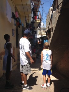 Site survery of potential village, barrio, and future medical clinic and church plant in the near future.  Andrew looks on with Pastor Juan Salazar after an intensive early Sat am basketball practice.