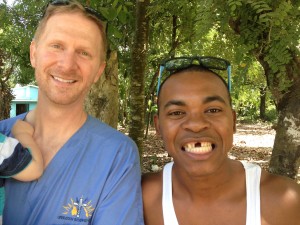 Dr. Adam Naler, DDS, and his first dental consult on their recent mission trip to the DR