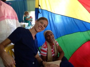 Sarah and a lady during a medical clinic who received Spiritual and physical healing.  Rachel works hard on Dental instruments cleaning and organizing in the background!